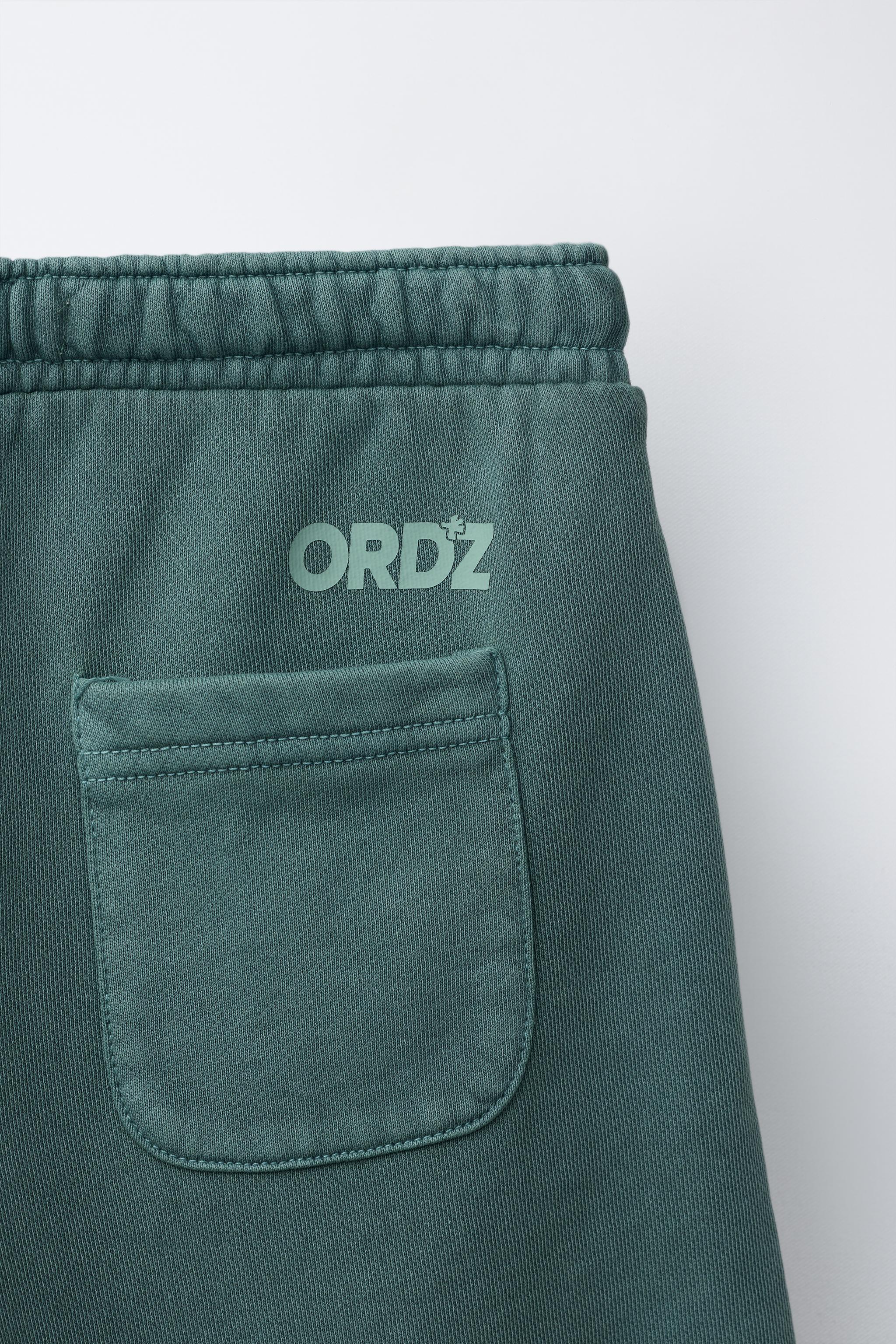 GARMENT DYED LOGO PLUSH SHORTS